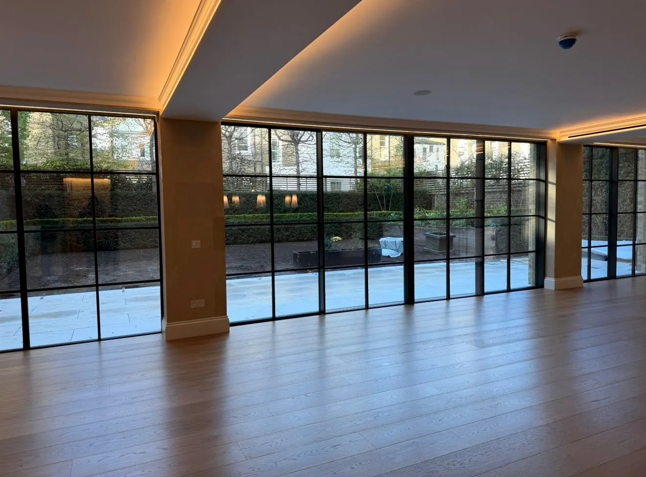 Clean garden room with full-height glazing after detailed cleaning
